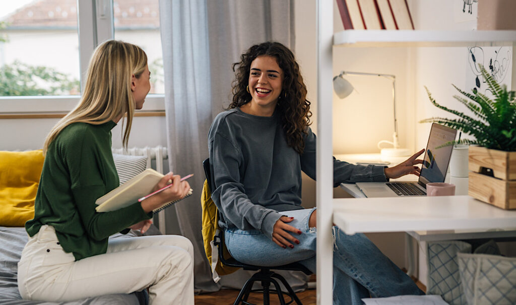 College students and roommates working together on a project in their apartment in Castle Rock, CO